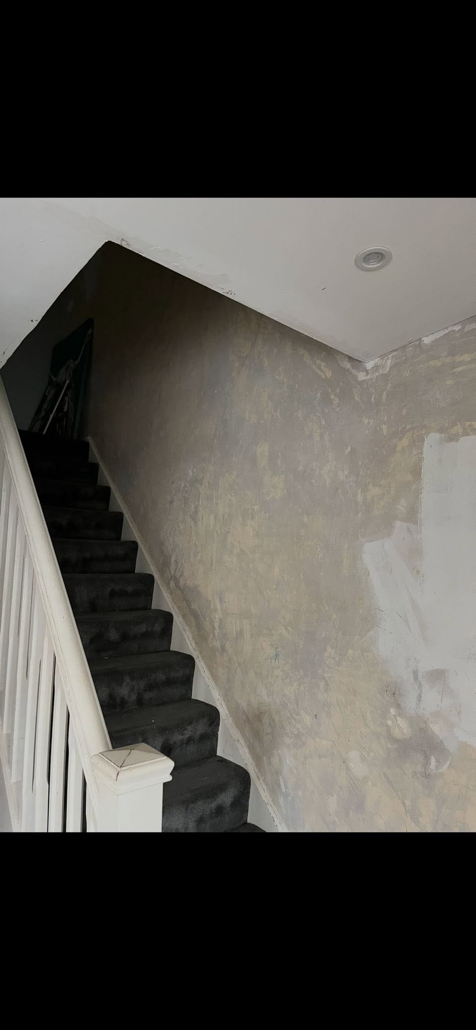 Rough stairwell walls before plastering